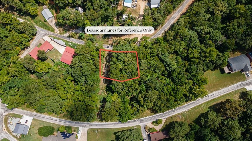 Awesome opportunity to own land and a boat slip on Beaver Lake in War Eagle Cove S/D!!  0.289 acre lot with wooded terrain.  Fully paved roads all the way to the property.  Bring a camper or perfect for a walk out basement.  Enjoy a  boat slip in a community dock that is a nice flat grassy walk to access!! Water is across the street.  Electricity is at the road.  Zoned for Springdale Schools.