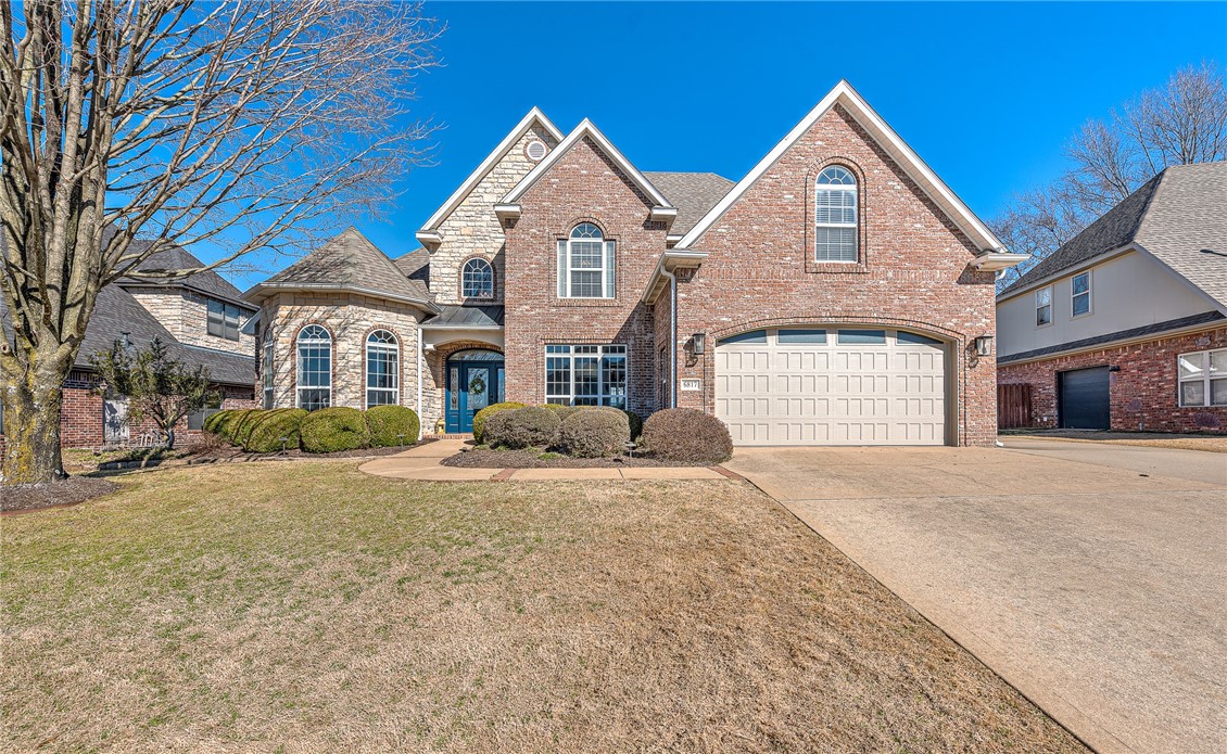 EXCLUSIVE SHADOW VALLEY BEAUTY! Professionally remodeled in 2018! You will fall in love with the wide-open living, kitchen & sunroom areas framed by a wall of windows overlooking the covered patio, beautifully landscaped yard and field beyond. The Owner’s Suite on the main level includes a bay window, creating the perfect nook for a sitting room or home office. A second bedroom on the main floor with ensuite bath is ideal for either a nursery or MIL Suite. Upstairs you will find 2 more bedrooms, a huge bonus/media/playroom and another full bath. Attached 2-car garage PLUS a detached 1-car garage with additional storage space & extra-large driveway/parking pad. Drive your golf cart just down the street to the Country Club where you can enjoy the many benefits of the golf membership that conveys with the property. Bentonville schools. New roof in 2020. Don’t miss this opportunity to capture one of the most sought-after addresses in NW Arkansas – the fabulous, gated community of Shadow Valley!