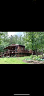 15 ACRES SECLUDED!!! This 3 bedroom, 1 and a half bath hidden treasure is just waiting for you to come sit on the wrap around porch, sip your drink and listen the babbling creek in the nearby woods. Home is 1488 sq ft of RUSTIC CHARM! Ready to move in or rent out! Would be a PERFECT VRBO with just shy of 15 secluded acres and a meandering creek you will be surrounded by nothing but the peaceful sounds of nature. Don't wait!! Call today for yourshowing!