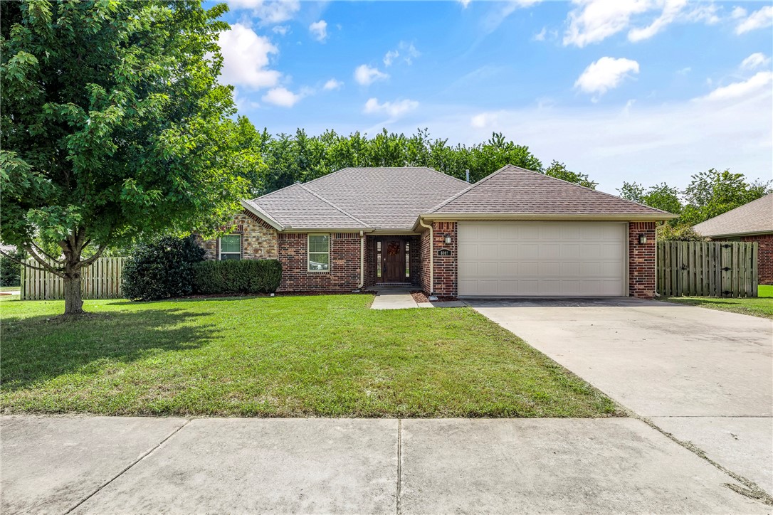 Seller will help with buyer's closing costs, up to $5k with acceptable offer! Tour this spacious 3 bed/2 bath brick home, before it's gone.. Located on a corner lot at the edge of the subdivision, there are no homes to the east and a row of trees behind, providing more privacy than most S/D homes. This home features vaulted ceilings, hardwood floors and a beautiful gas log fireplace. With the open, split floor plan, the elegant primary suite located off the living room, has its own hallway, providing extra privacy. The bath has a jetted tub, walk-in shower and 2 spacious walk-in closets. The dine-in kitchen is open to the living room and covered back deck and faces south for cozy winter sun and away from the hot sun of summer. The 2nd and 3rd bedrooms also have walk-in closets for plenty of storage. Washer, dryer and frig to convey!!! Plenty of floored attic storage too. This is a very nice area, of well-kept homes. Privacy fenced back yard for the pets. Come visit this welcoming home for your family today!
