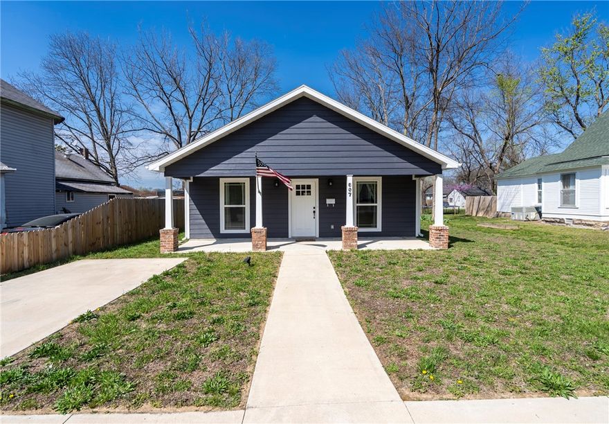 Nestled within the historic district of Siloam Springs, this newly constructed home exudes the timeless charm of yesteryear while offering all the modern conveniences desired by today's homeowners. Just two blocks from the Library and amphitheater and a mere four blocks from the bustling center of downtown, this residence strikes the perfect balance between location, nostalgia, and contemporary living. The original front door, now repurposed as the pantry door, serves as a striking focal point and a tangible connection to the home's historical roots. The original mailbox, a small but significant relic of the past, stands proudly by the entrance, a symbol of continuity and heritage. The light fixture by the carport has been carefully restored and reinstalled, adding to the authentic charm of the property. Built to blend with existing homes on this street, originally platted in 1881, the 2 carport offers parking at the rear and front of the home. Appliances are new as home was never occupied.