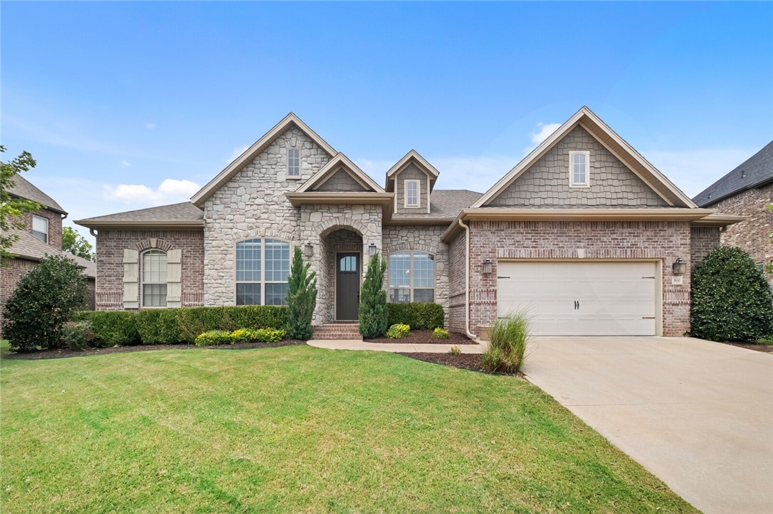 Well-appointed one-level home in a desirable neighborhood just 10 minutes from downtown Bentonville. This 4-bedroom, 2.5-bath property offers 2,561 sq ft on a spacious lot with mature landscaping. The open-concept layout features hardwood flooring, abundant natural light, living room with gas fireplace and built-ins, and a large kitchen with a gas range, stainless steel appliances, granite countertops, an oversized island, and a walk-in pantry. The spa-like primary suite includes dual vanities, a large walk-in closet, and a corner jetted bathtub with stone surround. Additional highlights include a formal dining room, generous storage, and spacious laundry room. Outside, enjoy the fully fenced backyard with a covered patio. Located in a quiet community with larger lots and a neighborhood park, with convenient access to schools, I-49, shopping, and restaurants. Bentonville Schools
