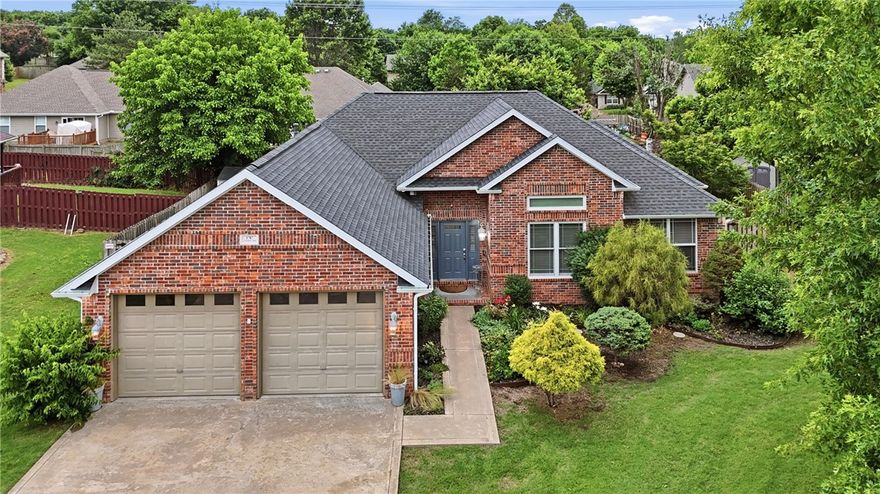 This contemporary style, one-level home in west Fayetteville is close to an abundance of amenities and conveniences. Only 1 block to the recently remodeled community pool with beach entry, 7 minutes to I-49, 11 minutes to University of Arkansas, and a short drive to grocery stores, restaurants, and entertainment. Enjoy the beautifully landscaped backyard from the huge deck with pergola and dog ramp. Fresh paint throughout most of the interior, split bedroom floor, huge primary suite, stained concrete and tile floors throughout, double-sided fireplace with gas logs and remote control, updated faucets throughout, designer ceiling fans with remote, recently updated electrical panel and whole-home surge protector, HVAC and roof are less than 5 years old, and new Anderson custom windows in the front sitting room. Kitchen fridge, garage fridge, washer, dryer, Arlo security camera, shed, and bird bath convey. Several furniture pieces are for sale or possibly negotiable with acceptable offer.