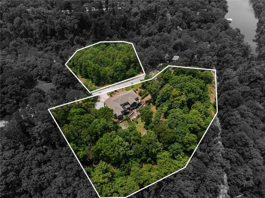 Welcome to Your Beaver Lake Oasis, this is more than just a home, it offers a lifestyle. 5.01 acres of privacy. Buildable lots available next door and across the street. Hop on the golf cart (conveys w/ the home) and be at your boat slip in minutes. The semi-open layout seamlessly connects the dining area, living room, & kitchen. The kitchen overlooks a sprawling deck that is excellent for entertaining or relaxing after a long lake day. The main floor features two primary suites. Second suite is complete with a full bath, living space, kitchenette, & private deck. Off the kitchen is a versatile office space. Downstairs, is a finished bonus room & full bath. Perfect as a game room, workshop, guest quarters, etc. Outside, additional bonus space with its own entrance that could be a home gym/movie room/etc. Ask for the full list of improvements! Whether you're looking for a peaceful full-time residence or a weekend escape, this home has it all! *Additional boat slip and 2.60 acres across the street also for sale.*