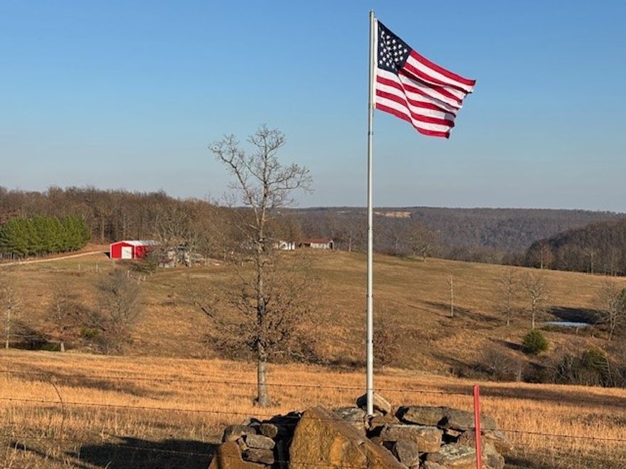 This picturesque 92 acres m/l includes a mix of pasture, forest, and views which accentuate this pretty farm in the heart of the Ozark Mountains. 3BR 2BA ranch home features a split floor plan, sunroom, & covered deck. Detached man cave/she shed, 2 barns, newer 30x40 garage/shop. Bring your animals to populate the pasture while the natural wildlife (deer, turkey, bear, etc.) roam the forest. Pasture includes fencing & ponds. Forest features include large rock formations, cave, and seasonal creek/waterfall. Lots of possibilities for the farmer/hunter/naturalist. This property has something for everyone, and when you rarely want to get a change of scenery, you're less than an hour to Harrison/Huntsville/Eureka Springs and slightly over to Fayetteville/Springdale/Rogers/Branson, MO,  Beaver, Table Rock, Taneycomo and Bull Shoals Lakes and the White, Buffalo, and Kings Rivers. In the center of many hunting, fishing, canoeing, swimming, camping, hiking and sightseeing venues! Come experience the Ozarks better from here!