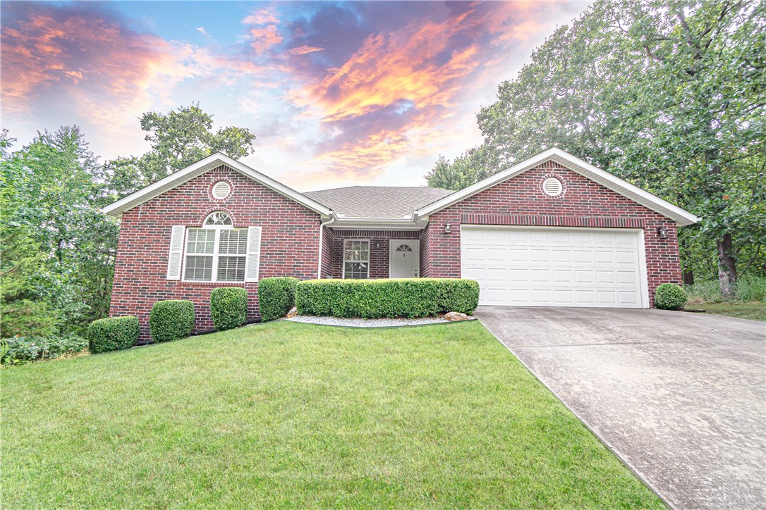 Welcome to your private Bella Vista home surrounded by beautiful trees! Enjoy a quiet and peaceful neighborhood. Winter lake view with quick access to HWY 71. Inside features cathedral ceilings, an ample amount of closet space, large windows letting in an abundance of natural light, open floor plan which is perfect for entertaining. Refrigerator, washer and dryer to convey. Retreat to the master suite - trey ceilings, dual sinks, and spacious, tiled walk-in shower. Bedrooms are spacious with walk-in closets. This home features a new roof, remodeled bathrooms, laminate flooring, and updated countertops in the kitchen. If you love being in nature and surrounded by wildlife, this home is for you. Welcome!