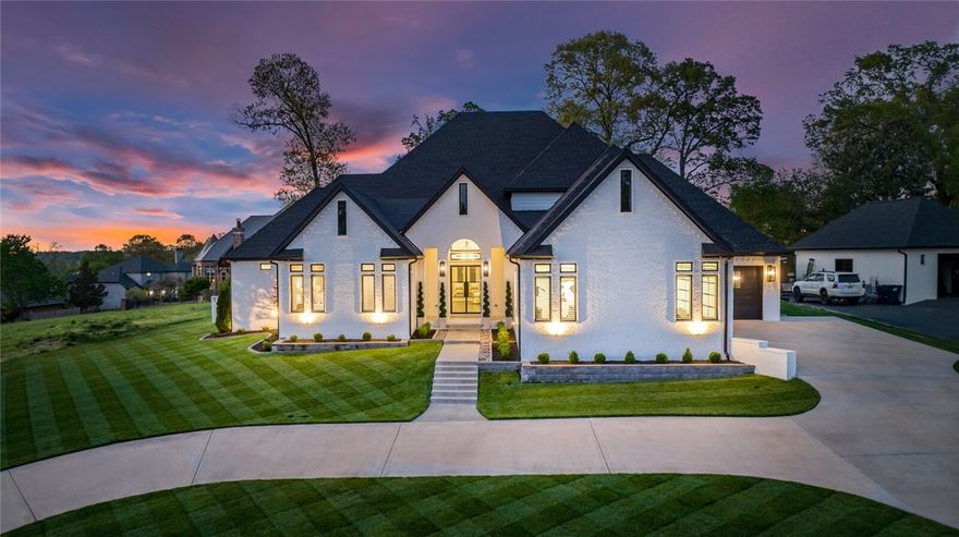 Timeless 5,563 square foot Pinnacle Country Club estate situated on almost 1/2 acre in Bentonville School District. Large main living room opens to the chef’s kitchen featuring top-of-the-line appliances, pot filler, ice machine, beverage refrigerator, large center island, quartz countertops, floor to ceiling cabinetry & breakfast room with views of green space. The oversized main level primary suite has a fireplace & features a luxurious spa-like bathroom with marble flooring, large soaking bathtub & shower & oversized dual walk-in closets. This home has 2 bedrooms, private study with built-ins, 1/2 bathroom & media/bonus room on main level. Upstairs offers 2 bedrooms with en-suite bathrooms & additional walk-in storage space. Immaculate 3 car garage with built-in heaters & cabinetry & epoxy flooring. The backyard is the perfect place for both relaxing & entertaining under the large covered patio complete with private motorized screens & fireplace overlooking the European style backyard with lush landscaping.