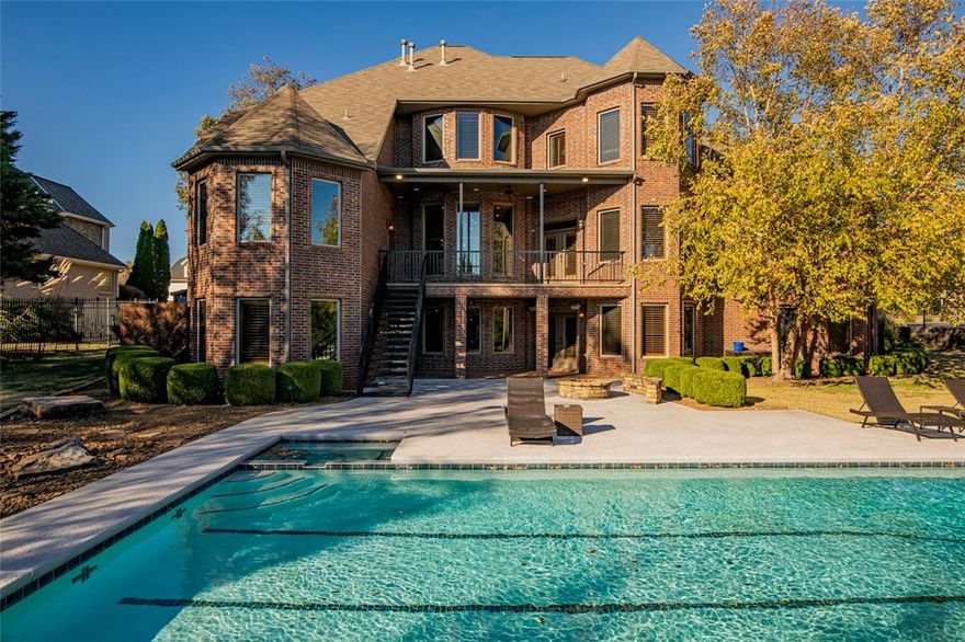 Stunning, pristine, classic! Located in the distinguished Pinnacle Country Club in the heart of SW Rogers, and the Uptown District. You'll be greeted by a grand 2-story entry and dramatic winding staircase. This beauty features interesting architectural details and immaculate hardwood floors, floor to ceiling windows, soaring 20-ft ceilings and custom millwork. A perfect place to unwind and entertain guests, this 8139 SF Estate offers 2 well-appointed kitchens, 2 family rooms, 2 multi-purpose/bonus rooms and 3 staircases. The main level also offers an open eat-in kitchen, butler's pantry, formal dining and private study. Perfect for a large or growing family boasting 6 oversized bedrooms and 5.5 baths. Downstairs features luxurious entertaining including a billiards room, home theatre, exercise room, and a ping pong/foosball room. The private backyard oasis boasts a lap size pool, sports court, firepit and a newer 650 SF pool house with everything you need. A showplace indeed!