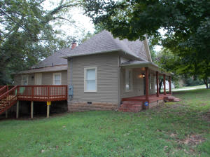 This house has been totally redone brand new kitchen cabinets, brand new roof, new paint, new fridge, microwave stove,dishwasher, new ceramic tile in bathrooms, new Central Heat And Air Heat pump,Granite counter tops,Cedar siding, 2 decks, lots of beautiful trees,nice porch, beautiful Furniture in the house that might stay, very well insulated,no wasted space in this home must see!!!