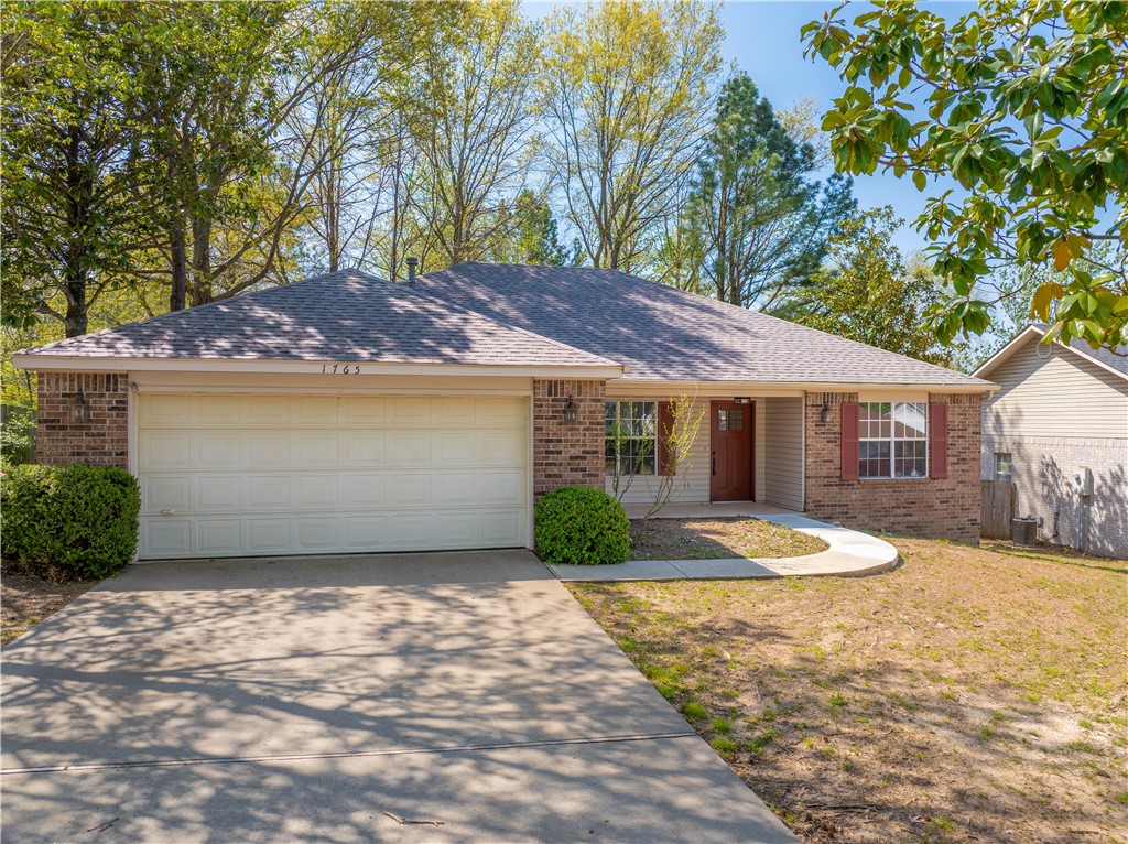 Move-in ready and perfectly located in walking distance to Tyson Foods headquarters and 71B! This 3-bedroom, 2-bath home features a desirable split floor plan with fresh LVP flooring throughout living room and bed rooms. The kitchen offers new granite countertops, an eat-in area, and a separate dining room for added space and flexibility. Enjoy the outdoors year-round with both a covered front porch and a covered back porch—great for relaxing or entertaining. The 2-car garage adds convenience, and the home’s location near the business district, shopping, and dining makes everyday living a breeze.