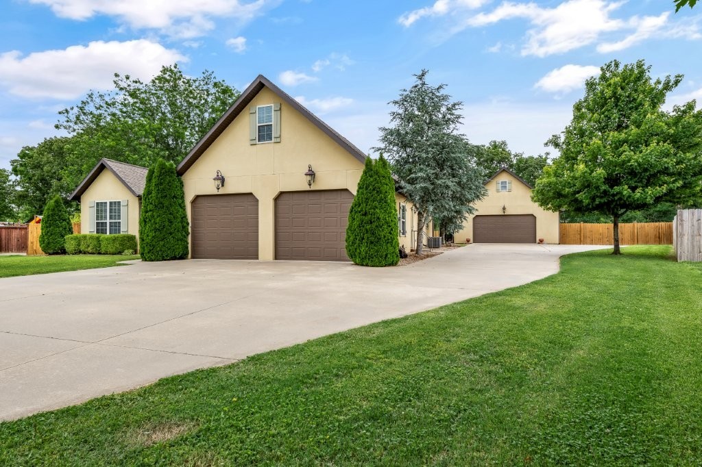 Custom built, this 3bed/2bath home is located in desirable Tucks Crossing. Thoughtfully designed with luxury & function in mind, this home offers an open-concept layout featuring vaulted ceilings, LVP flooring & custom built-ins throughout. The heart of the home is the beautiful kitchen, complete with abundant cabinetry & storage. Outdoors, enjoy the expansive .92-acre lot with a large covered patio and a bonus is the impressive 1,200 SF shop, equipped with built-in cabinets and room for multiple vehicles—perfect for hobbies, storage, or additional workspace.