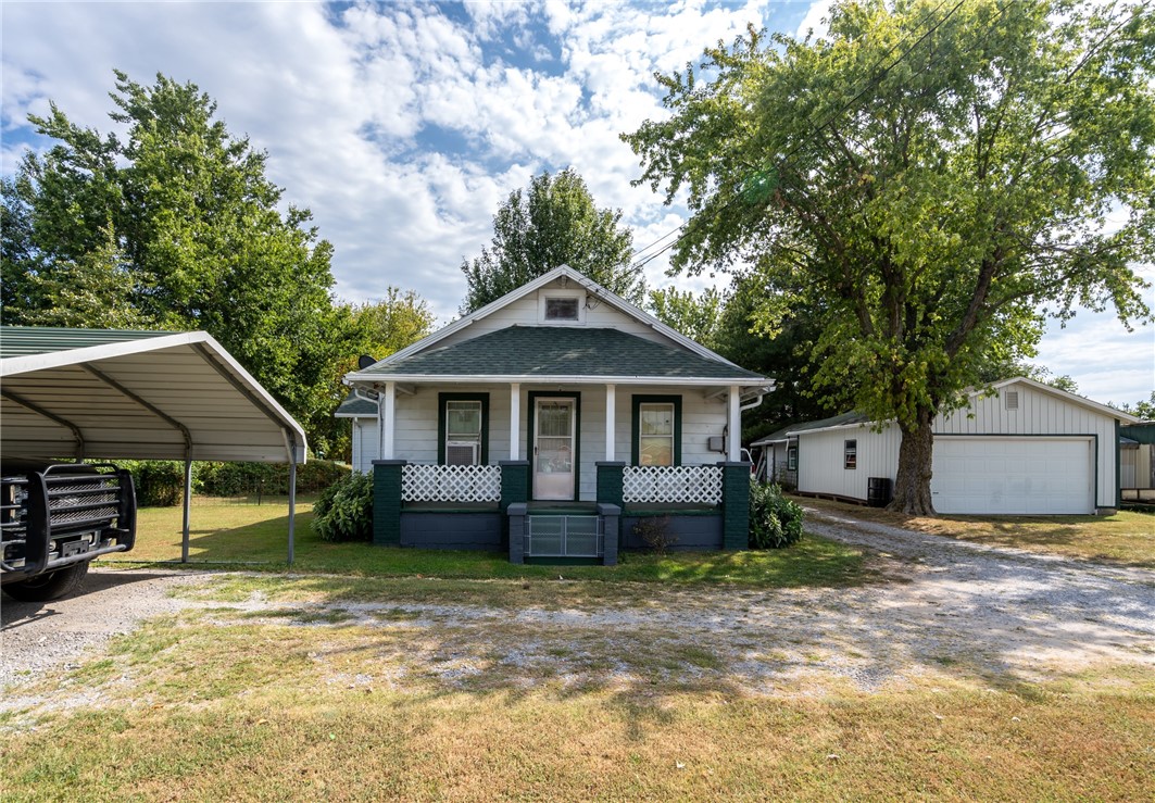 This cute little home is just a short walk to all the amenities of Lincoln. With 2 bedrooms, 1 bathroom and an open living room and dining area putting your own touches and updates will be such a fun project. The generous laundry and mud rooms connect to an added greenhouse and the back patio is absolutely charming. Add in the nice sized yard surrounded by plenty of foliage for a private feel and you have such a quaint place to make your home. The front porch is spacious enough for rocking, the carport provides extra vehicle protection and the oversized garage/workshop gives plenty of room for your gardening tools and extra storage. Sweet little fixers are few and far between. Don't miss this opportunity to come home to Lincoln!