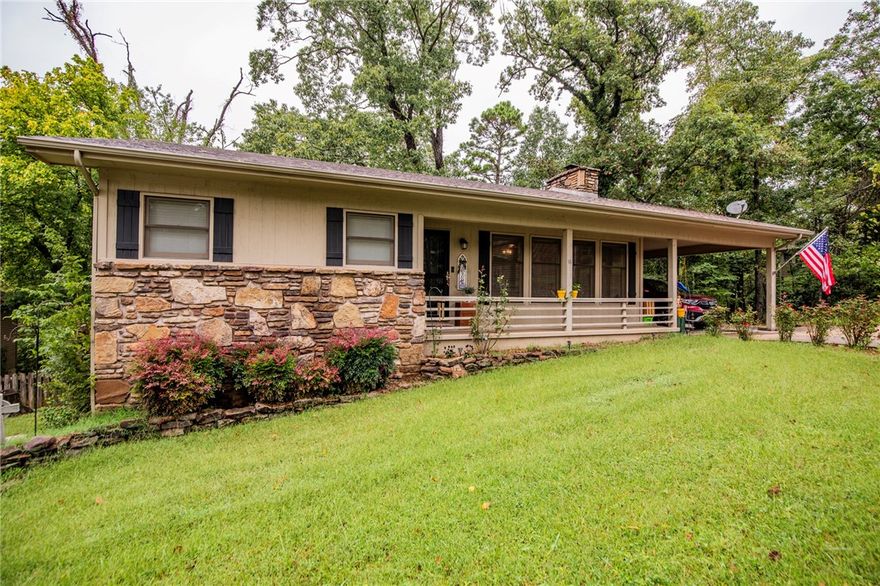 Adorable and cozy meets easy access. This quiet street is just a few turns off of 71B but nestled in the trees, you'll return to nature every time you return home. 2 spacious bedrooms and 2 full baths on sewer give functionality while the wood burning fireplace and back porch offer relaxation whatever the season. Close to golf courses and trails for your active lifestyle!
