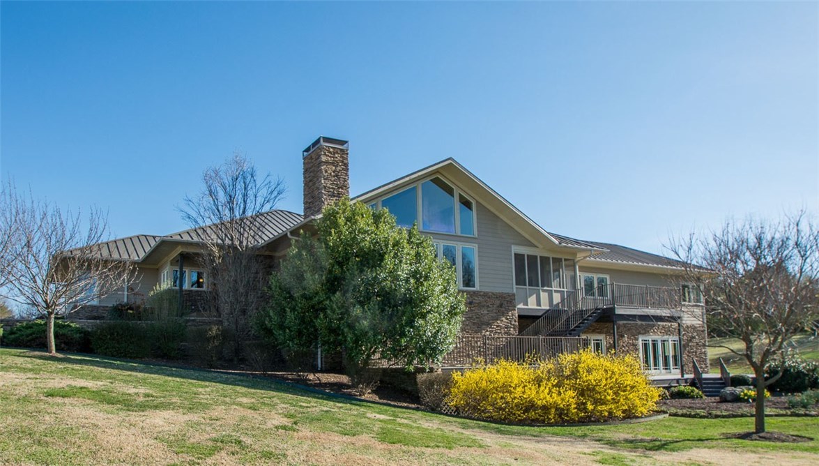 Welcome to this stately home that’s beautifully situated on 4.86 acres, more or less, & has fabulous views of the Prairie Grove valley. One-owner home was custom built by Gary Stiegler & quality is evident throughout. Custom cabinets, abundance of closets & storage, heated bathroom floors, composite decking are a few of the upgrades. Upgrade kitchen appliance package & Corian countertops & sinks. 3 screened-in porches. Hwd floors, geo-thermal five-zone HVAC, plantation shutters. Too much to list!