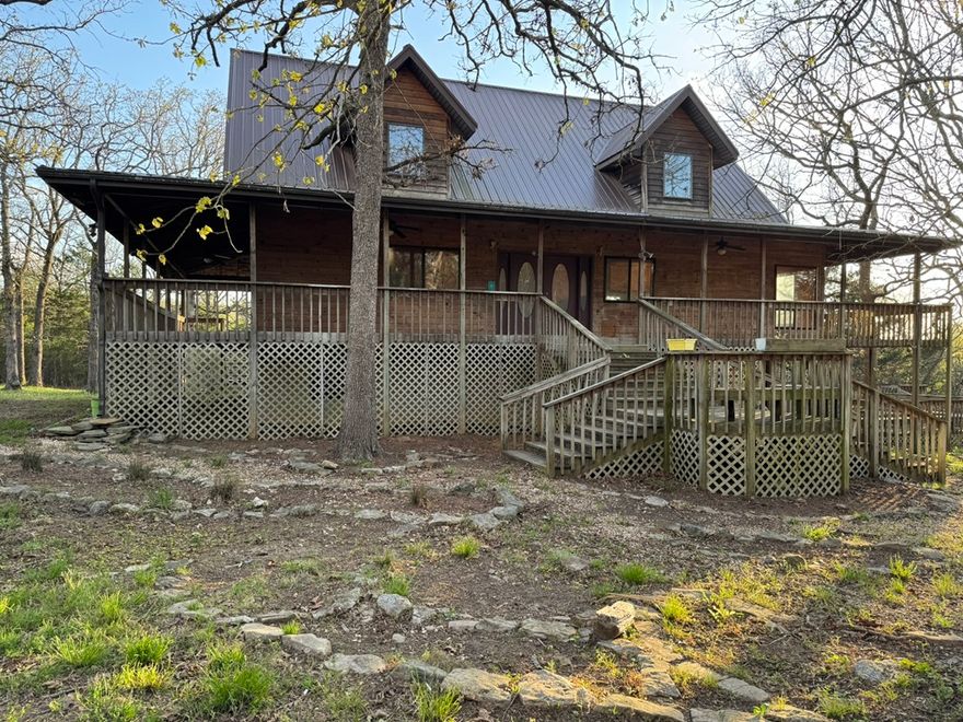 Discover your serene retreat in this stunning craftsman-style lake home! Nestled on 5 wooded acres m/l bordering Corp land, this 5-bedroom, 4.5-bath sanctuary offers privacy and tranquility. Enjoy the expansive wrap-around deck, perfect for outdoor gatherings. The finished full basement provides additional living space, while the large, detached garage accommodates all your needs. Relax by the koi pond or unwind in the charming gazebo. Your dream home awaits!