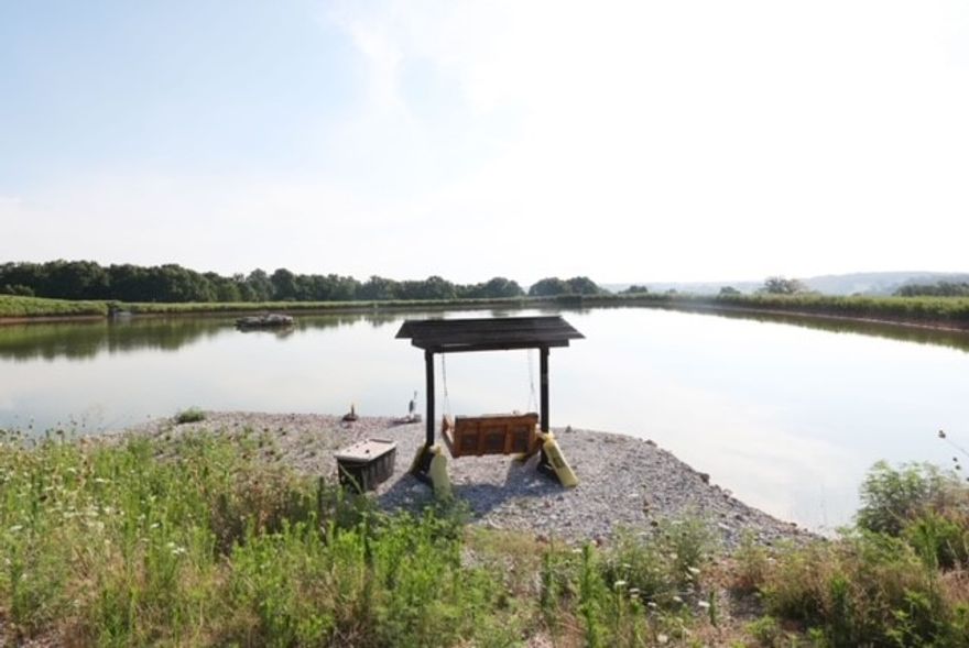 One of a kind property in North Bentonville. Gorgeous 77 +/- acres close to town on which to build your dream home. A wonderful combination of all the best features you would want for your property. Spacious open flat meadows and rolling ozark woods, with abundant wildlife. Fish your own private pond stocked with trophy-sized bass and catfish with solar panels to power aeration. A true sportsman's paradise!! Next to an exclusive subdivision, yet very private and secluded. Country feel, with quick access to Downtown Bentonville. Coler Mountain Bike Preserve is just 1.2 miles away. City utilities (water, electricity, cable). The property includes a 2400 sq. ft. insulated barn with concrete floor and 220 electricity powered by solar panels. City water, and also a high capacity well. Six parcels included in this listing. Setup your showing today!