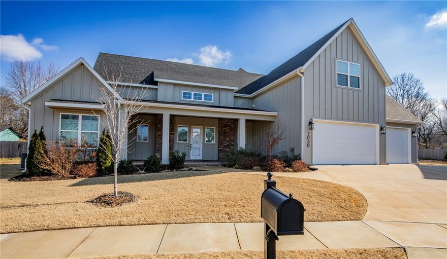 Move in ready-high end finishes. 4-bed-3.5-bath in Dutton Woods, tall ceilings open-concept with natural light.  Primary suite on the main floor features 2 large walk-in closet, spa-like bathroom, double vanities, walk-in shower, & soaker tub. Upgraded display shelving and cabinets in living room. The kitchen showcases custom cabinetry, large island, double wall ovens, gas range, & a spacious pantry.  The laundry room has been upgraded with custom cabinetry & added storage. Upstairs includes three additional bedrooms, two full bathrooms, & a generous bonus area. Additional highlights include seamless epoxy garage floor, updated paint, electrical upgrades, efficient gas hot water tank, blinds, alarm system, upgraded fixtures. Landscaping with multiple newly planted trees enhances both privacy and curb appeal. Covered front and back porches on a flat lot, conveniently located near shopping, dining, & quick interstate access. Situated in the Root School District & near Woodland Junior High. Near Razorback Greenway!