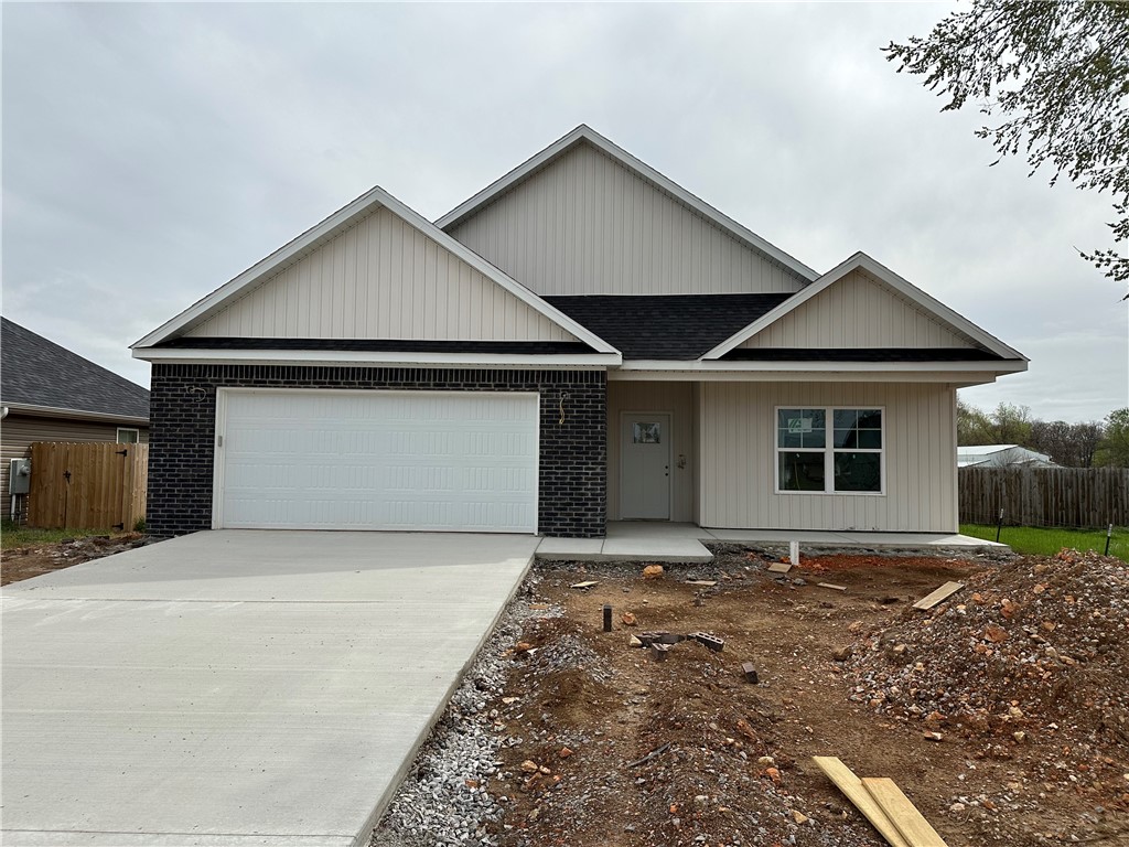 Welcome to Phillip's Park! Beautiful quality New Craftsman style homes in the center of it all in Gentry; close to Gentry Schools, City Park and Gentry Splash Pad. The Wyatt features 3 bedrooms, 2 bathrooms, full wood cabinets, pantry, granite countertops, open floor plan, large island, linear gas fireplace, large utility room and covered porch. Complete with vinyl siding, brick and double pane windows for energy efficiency and curb appeal.