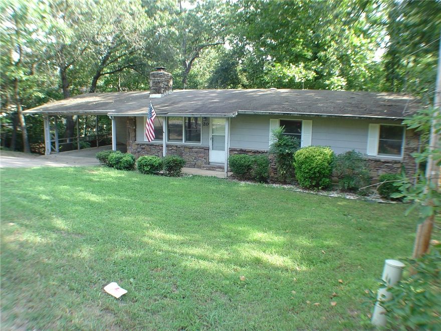 This large family home boasts lots of storage, especially in the basement. Main level has spacious living room, sunroom, kitchen and bedrooms, while walkout basement features a large, open family room and bathroom as well as a huge area of unfinished storage space or workshop area. Good location with easy access to Forrest Hills Blvd and less than a ten minute drive to Walmart and gas stations.