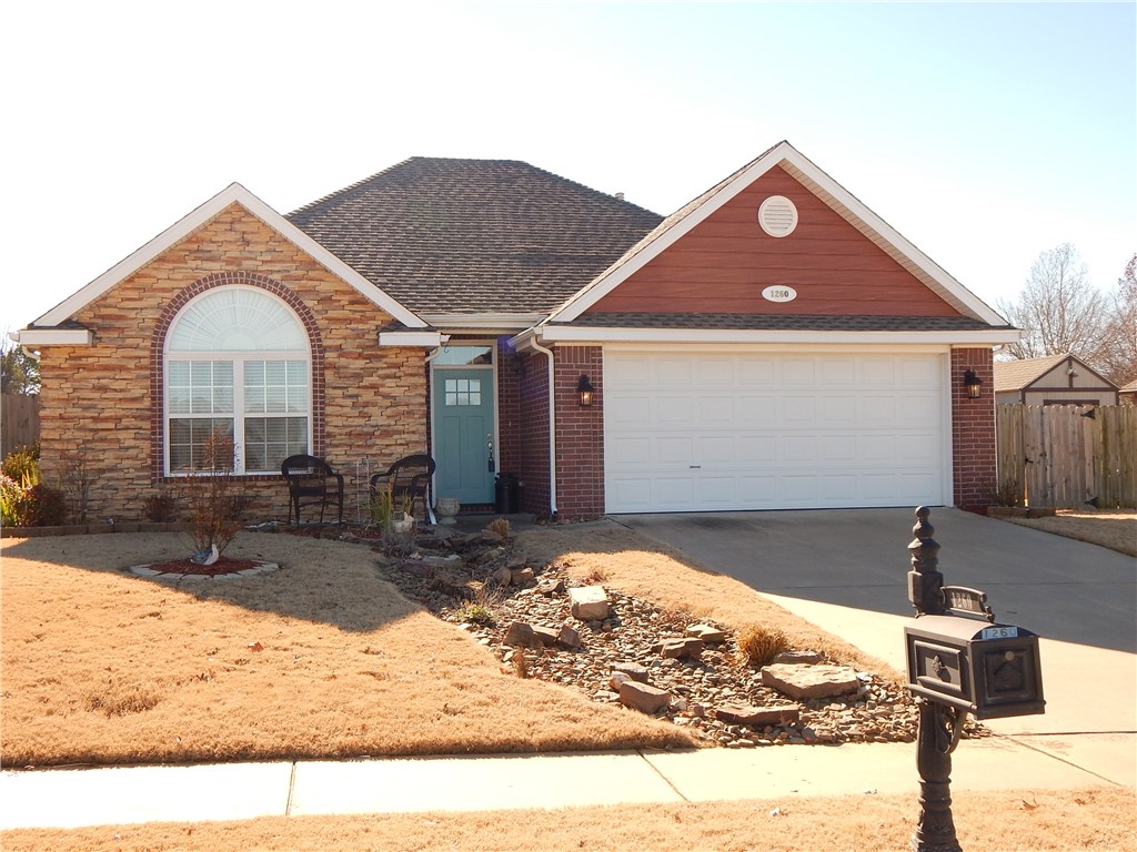 Beautiful brick/rock home in quiet Fayetteville neighborhood. Soaring ceilings w/ crown molding in living room features gas log FP. Open concept - this house lives much larger than you'd expect. Generous windows give loads of light in the dining area/ kitchen. 3cm granite countertops, updated lighting, pantry, glass top electric stove - you'll love this kitchen. The covered patio makes entertaining a breeze! Good sized backyard with wood privacy fence. 10' x 12' storage building for all the extras!