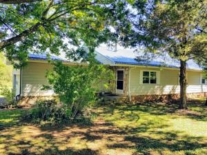 Unique opportunity on this property with Two dwellings, outbuildings and a 4.5+ acre lot. You have a 3 BR, 2BA home with 1250 Sq. Ft.. Living Area with attached double garage and large unheated/cooled enclosed porch/sun room. Manufactered home is 1405 Sq. Ft. 3BR, 2 BA with large front deck. Great opportunity to live in one home and rent the other out or have it for a In-Laws Quarters or for another family member. Both dwelling are partially furnished as well. Property being sold ''AS IS''. Owner acquired property through an estate. SEE SUPPLEMENTAL SHEET for room sizes and features on manufactured home.