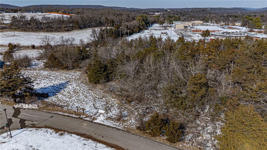 Prime 7.4± acres in the heart of West Fork! This gently rolling tract offers an excellent opportunity for development or investment, located just off Smith St with additional frontage on Park St. Conveniently situated next to West Fork Schools, minutes from downtown West Fork, and a short drive to I-49. Approximately 4 acres are cleared with the remaining 3 acres wooded, providing a desirable balance of open ground and natural surroundings. Electric and water available at the street. Layout and location offer strong potential for a future subdivision or other residential development (buyer to verify feasibility, zoning, and utilities). A rare opportunity to secure acreage in a growing area with close proximity to schools, shopping, and commuter routes!