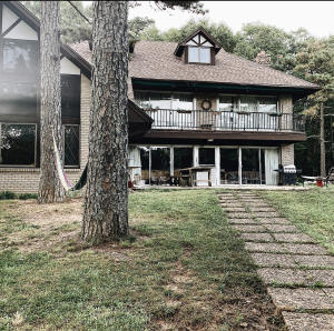 This beautiful 5 bedroom 3 1/2 bath home sits on 29+ acres that adjoins the National Forest on 2 sides that gives you plenty of room to roam and enjoy the outdoors. A fireplace and lots of windows will make for a cozy spot on a cold day to still enjoy the outside view.