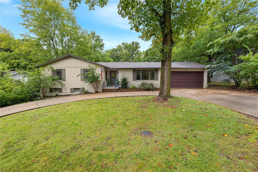 This charming home offers more than a beautiful place to live—it’s an opportunity. The  main home has been beautifully restored and features the original wood floors, a cozy wood-burning fireplace, and updated kitchen and bathrooms with classic, time-period finishes. The main level includes the majority of the living spaces, while the walkout basement is an oversized room that is perfect for a fourth bedroom, office or den and includes a full bath and tons of storage space! What truly sets this property apart is the fully renovated 437 sq ft ADU. Perfect for long- or short-term rental income, a guest house, or multigenerational living. The guest house adds built-in value and flexibility for any lifestyle in any season. Step outside and enjoy the backyard garden and fountain, a peaceful retreat just minutes from everything Fayetteville has to offer. Located near the Razorback Greenway, this home provides easy access to biking, walking, and exploring the city. You don't want to miss this rare investment!
