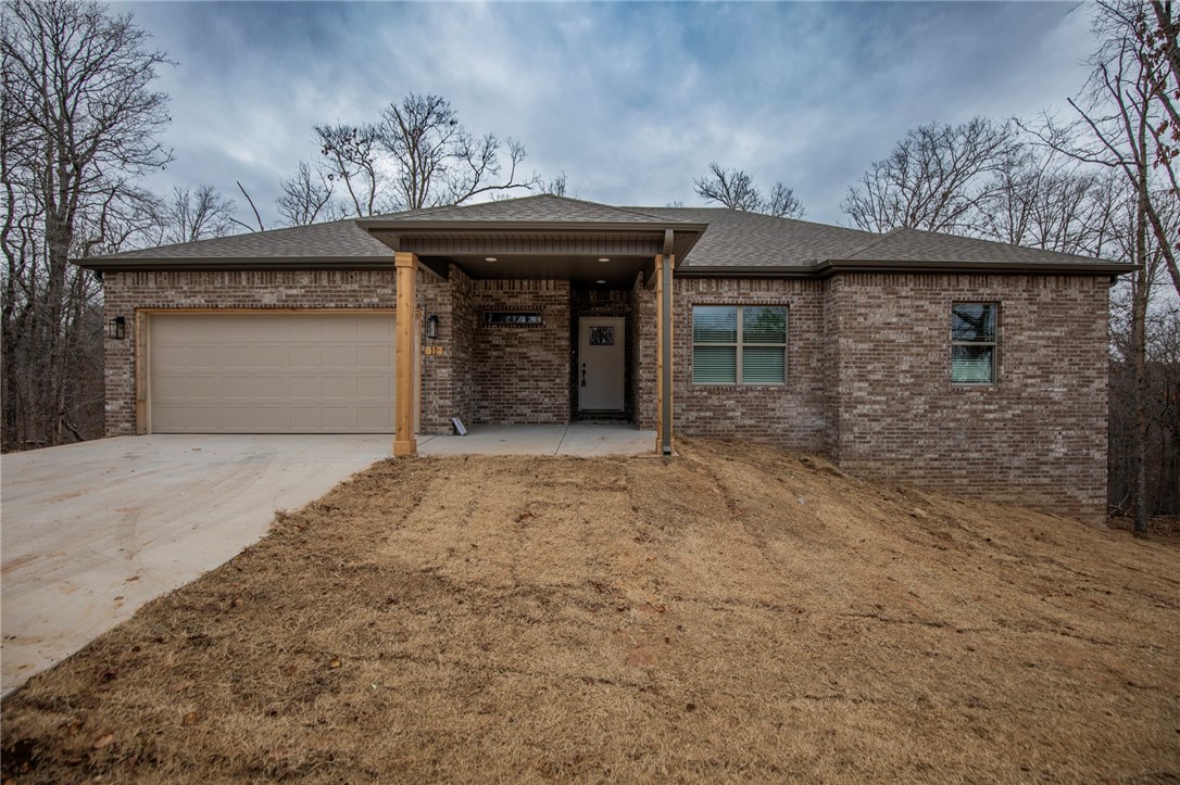 Beautiful new construction home. Hard to find three-bedroom, three full bathroom two living area home tucked into the tree covered hills of Bella Vista. Real hardwood floors in upstairs living, kitchen and primary suite, quartz countertops, beautiful porches and great bonus space make this home even more desirable. Trails, golf courses, lakes and the outdoor life abound. On Sewer!