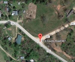 Level lot on dirt road located in Omaha; no restrictive covenants; available utilities are electric, natural gas, and septic on site; owner is severing a portion of land from a bigger parcel