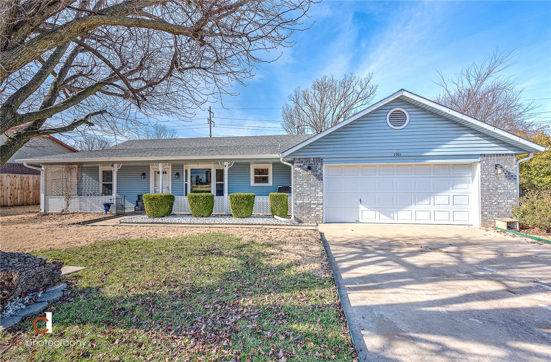 Beautiful home with tons of updates. Roof approx 5 yrs old with warranty, granite window seals, porcelain tile & engineered hardwood throughout, 4 inch gutter all around, stove has gas or electric hookups, heat & air unit approx 6 yrs old w/ warranty, brand new dishwasher, garage fully insulated, new window world window installed last 3 yrs w/ warranty transferred to new owner, double divided storage buildings. Don't miss this amazing home in the heart of Springdale.