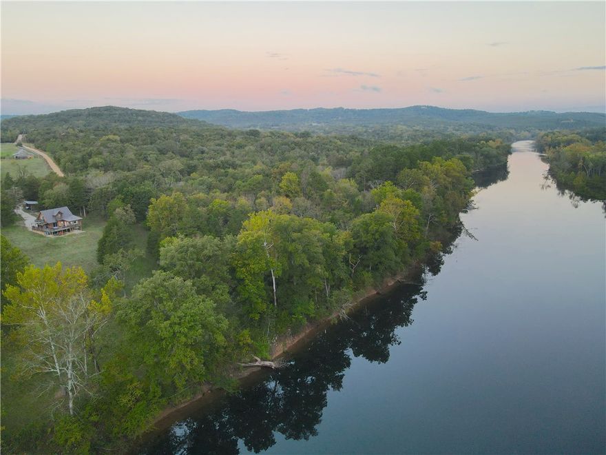 Escape to your own stretch of the White River with this fully remodeled 4-bedroom, 3.5-bath cabin offering over 500 feet of river frontage and 6+ private acres of pure Ozark beauty. The 2,539 sq ft interior has been completely updated with contemporary finishes and thoughtful touches throughout. The main level features an open layout with deck access from the master suite, while upstairs, one bedroom has its own private balcony and another includes a bonus sleeping area perfect for guests or family. The walk-out basement adds a second living room, giving everyone space to unwind. Located less than an hour from the Northwest Arkansas metro and just minutes from Eureka Springs’ dining and entertainment, this cabin offers the perfect blend of privacy and convenience. This stretch of river is known for fishing, the the boat ramp is close! With a strong income history as an Airbnb and VRBO rental, this property is equally suited as a private getaway, family retreat, full time residence, or income-producing investment.