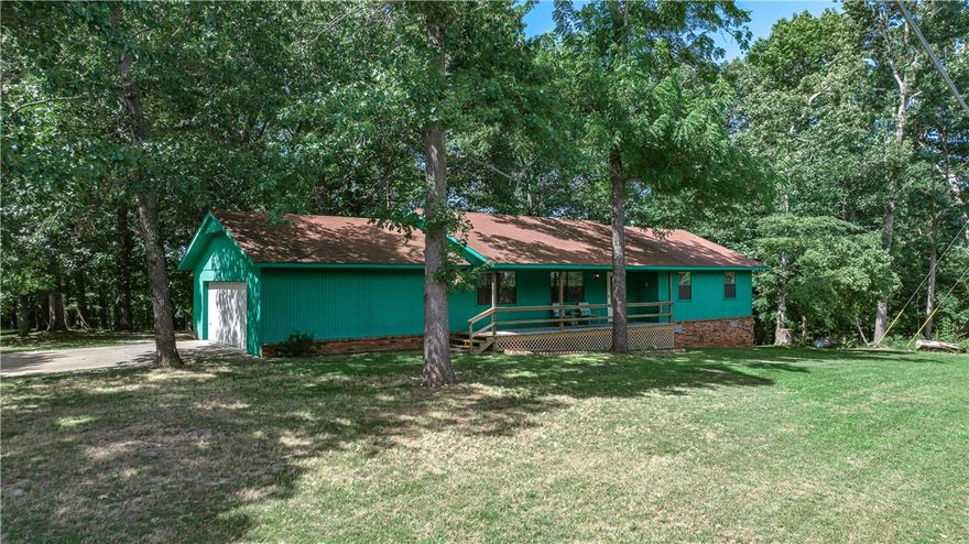 RD eligible! Great AirBnB potential as well.

Nestled just outside Horseshoe Bend Marina and Park, this beautifully remodeled home offers the perfect blend of modern comfort and natural tranquility. Situated on 2 scenic acres, you’ll enjoy daily visits from deer, birds, and other wildlife right outside your window. Sip your morning coffee on the front porch while taking in peaceful views of Beaver Lake, or unwind in the evening on the back patio as the sun sets over the trees and the deer stroll by.

Inside, the home has been thoughtfully updated with stylish finishes and a fresh, modern feel—ideal for a weekend retreat or full-time living. You’re only 10 minutes from downtown Rogers, giving you easy access to shopping, dining, and entertainment, while still enjoying the privacy and calm of lake-area living. Whether you're a nature lover, water enthusiast, or simply seeking a slower pace, this one-of-a-kind property checks all the boxes. Some pictures show virtual staging
