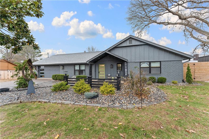 Rare Bentonville opportunity—nearly half an acre in a location where lots of this size rarely exist. This home offers exceptional land, flexibility, and value. The property features recent updates including a HVAC system (2024), new roof and wood fence (2024), and a spacious primary bedroom addition (2024). The interior is freshly painted, highlighted by a bold, designer-inspired jade primary suite. The kitchen was updated in 2021 with new cabinets, countertops, sink, and gas line behind the stove. Additional improvements include a new gas fireplace insert (2025) and exterior paint (2023). Outdoor amenities include a front-yard sprinkler system, large storage room, and a 3-person hot tub that conveys. The nearly ½-acre lot offers rare flexibility for a future ADU, guest house, home office, or gym. Located just blocks from Ozark Mountain Bagel, Cronuts Donuts, Harps, and neighborhood services, this home delivers walkable convenience, substantial land, and strong value—an increasingly rare combination in Bentonville.