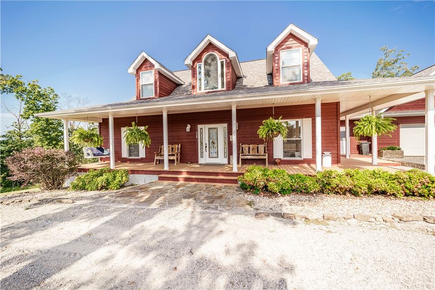 Located in the quiet Hillspeak community just south of historic Eureka Springs, this rustic yet charming home offers comfort, space, and thoughtful updates. Inside, enjoy the oversized jetted tub for two, a cozy propane fireplace, and a propane stove. Two new 50-gallon water heaters were installed in 2024, and the cedar siding—naturally bug-deterring—was freshly stained in spring 2025. A new roof in 2019 adds both style and peace of mind. Step outside to a large deck with an outdoor wood-burning fireplace, ideal for gatherings, and an outdoor kitchen with granite countertops. The spacious shop building includes a loft, bathroom, and bunk room, creating flexible space for guests, hobbies, or storage. Tucked at the end of a quiet road and just minutes from Beaver Lake, this property combines privacy, functionality, and easy access to all that Eureka Springs has to offer. Schedule your showing today and experience this special property for yourself.