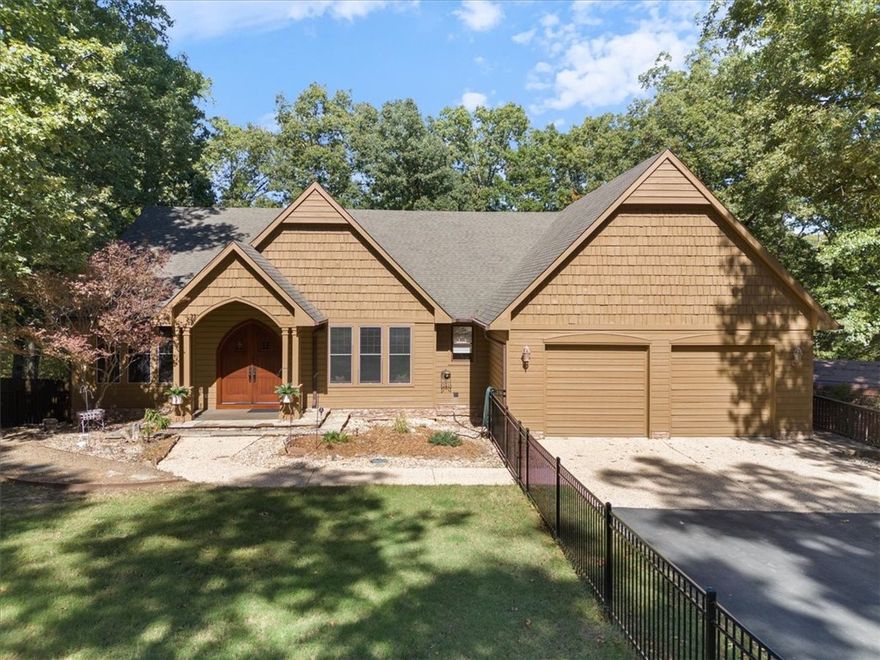 In Aesop's fable "The Town Mouse and Country Mouse", the cousins visit each others homes and discover that they each prefer their own.  The city mouse stays in the city and the country mouse stays in the country.  What's nice about this lovely home on Alfred Road is that you can actually get the best of both worlds.  While it is country lving, 5.59 acres and 10 minutes from Bentonville, it lives like a city home.  There is no lack of comfort here.  Upon entering you feel like you've entered an old world lodge, bespoke cabinetry, that is lovely and ornate, wood floors, cooks kitchen, ample living space with family room, office, and enormous screened in back deck.  The home features 2 primary bedroom suites with attached baths, a second living room, a game room, or media room, and another covered patio below.  A heated cooled workshop with an Rv barn complete this magical property.  While the city and country mice had to decide, with this home you don't have too, "Country roads take me Home",sing it and live it here.