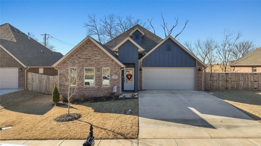 This beauty is a 3 bedroom, 2 baths with 2 car garage.  Primary bedroom with trey ceiling, lots of natural light, large walk-in closet and gorgeous bath with double sinks, granite countertops and tile shower.  The eat-in kitchen has stainless steel appliances, granite countertops, gas range, dishwasher and built-in microwave.  Living room is open to the dining area and kitchen.  Home offers a gas log fireplace in the living room, wood-look ceramic tile through-out the home with carpet in the bedrooms.  Great location within just minutes to XNA and Wal-Mart DC