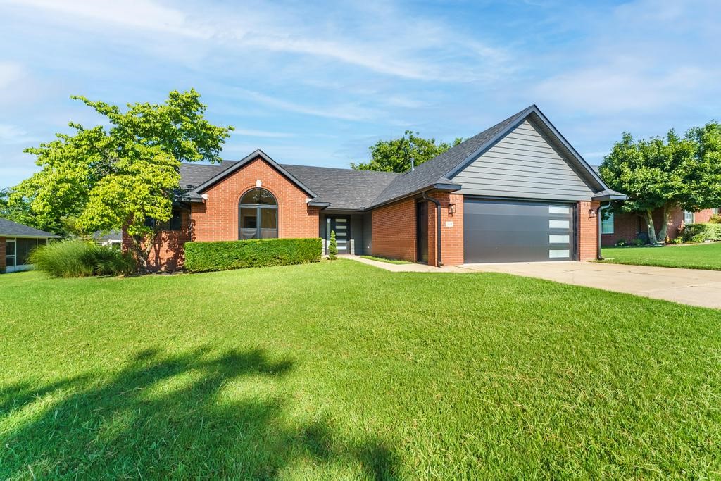 Welcome to 708 N 28th St in Rogers, AR. This 3-bed, 2.5 bath, brick home sits on a quiet cul-de-sac and features sleek modern exterior finishes and a 2-car garage. There are tons of thoughtful updates throughout the house. On the exterior, find a new roof, siding, facia, soffits, gutters, front door & windows (2024). On the interior, find new LVP flooring flowing throughout the main living space and bedrooms, new light fixtures, trim, shower inserts & paint. Kitchen features a pantry, stainless appliances and tons of counter & cabinet space. In addition to an oversized living room, there is a dining room space & a flex space with French doors that would make a perfect office, family room or sunroom. The primary bedroom is huge and includes a large walk-in closet, dual vanities and a walk-in shower. The two secondary bedrooms are very large as well. Conveniently located in Rogers near I-49 and just 3 miles to Downtown Rogers and 4 miles to the new Walmart campus.