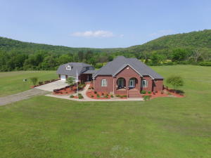 RANCH SPECIAL Home features over 4700 square feet of the finest custom built home that you will find. Beautiful Hardwood floors, granite and Quartz countertops, security system, 3 BR and 3 Bath inside the home. The mother in law quarters above the heated and cooled 3 car garage features a fenced back yard, heated storm room, 1 BR , 1BA, with washer and dryer hookups.