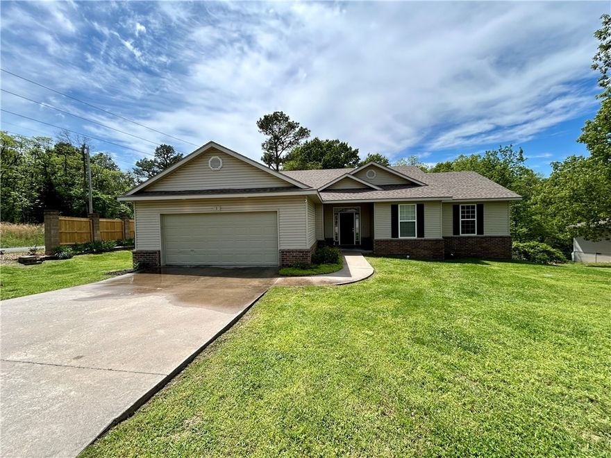 Welcome to your new home in scenic Bella Vista! This 3-bed, 2-bath gem offers more than just a place to live—it's a gateway to an active lifestyle. Situated seconds away from the breathtaking Back 40 mtb trails, outdoor enthusiasts will thrive in this vibrant community. Enjoy morning coffee or soak in the mesmerizing Ozark sunsets from your expansive, partially covered back deck. Step inside to discover the charm of original oak flooring & freshly painted walls & ceilings, creating a warm, inviting atmosphere. With new new carpet in the bedrooms, this move-in ready home offers both comfort & convenience. The kitchen and living room impress w/ 13-ft ceilings, adding to the spacious feel of the home. Minutes to Metfield & 3 lakes, outdoor adventures are always at your fingertips. Bentonville schools ensure top-notch education. The flat driveway and front yard provide ease of access & curb appeal. Whether seeking a turnkey residence or envisioning a personalized touch, this property offers endless possibilities.