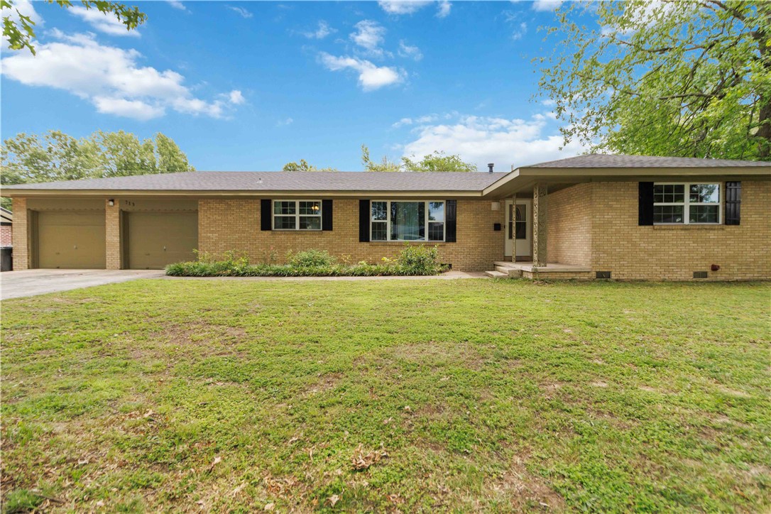 Welcome to 713 Carlton St in the heart of Springdale! This spacious 4-bedroom, 2-bath home is located in a well-established neighborhood. The standout feature is the large tandem 4-car garage, perfect for restoring cars, storing a boat, creating a workshop, and still having space to park your vehicles. A big storage building in the backyard adds even more room for tools, equipment, or hobbies. Great for entertaining due to large driveway, granite countertop island in kitchen, large yard, and just the coziness overall. Conveniently located near schools, parks, and shopping. The cherry on top is a new roof will be installed prior to closing! Welcome home!