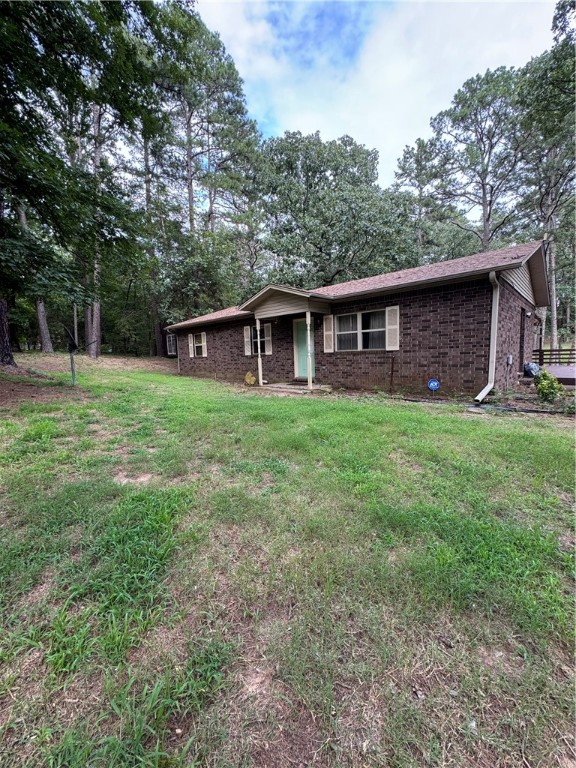 This 4-bedroom, 2-bath home sits on 1.87 acres, offering privacy and room to roam. Enjoy a large backyard with mature trees, a wooded backdrop, and plenty of space for outdoor living on the oversized deck. Features include a carport, two versatile outbuildings for storage or hobbies, and a peaceful setting thatās still convenient to town. A perfect blend of comfort, space, and country charm!