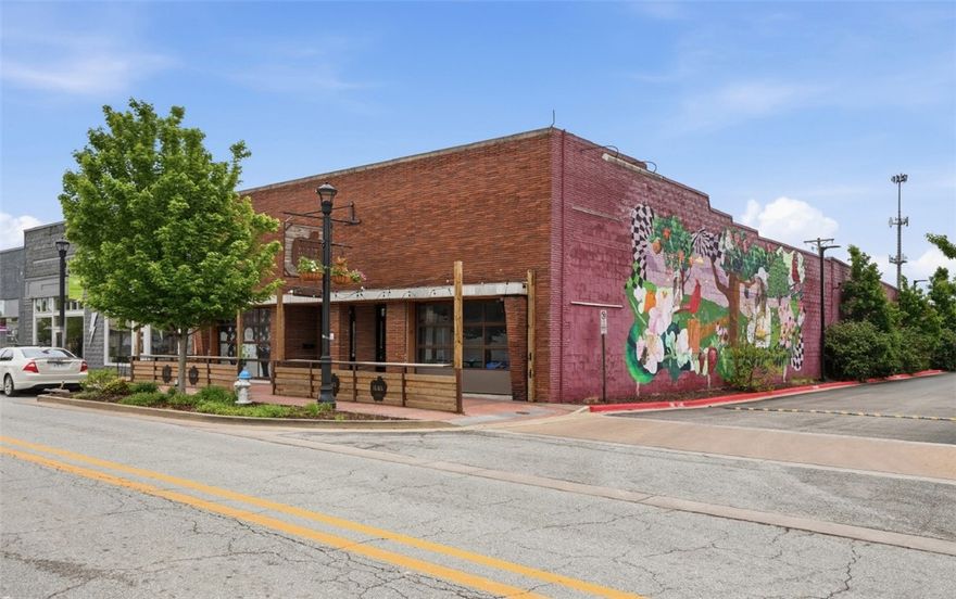 Highly visible retail space available for lease in the heart of Downtown Springdale. This ±6,194 SF property offers an exceptional opportunity with frequent foot traffic and a prominent location. Features include a loading dock, a former tasting room setup, and a large patio space, making it ideal for a variety of retail or restaurant concepts. Position your business for success in this vibrant and growing downtown district.