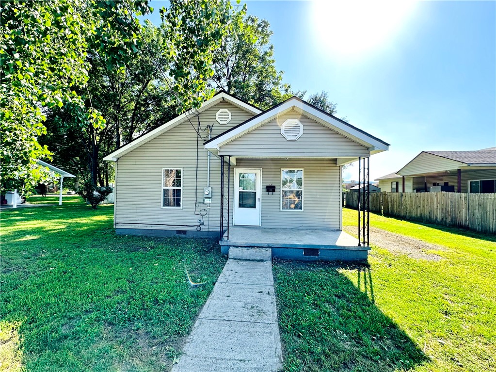 Charming 1920s cottageāfully remodeled & move-in ready! Just minutes from Dardanelle Regional Medical Center, this 896-sq-ft home blends vintage character with modern comfort. Refinished original hardwood floors flow through an open living area with ceiling fans and natural light. The retro-chic kitchen features olive-green cabinetry, butcher-block counters, white subway-tile backsplash, patterned ceramic floors, and a second fan. Two bright bedrooms offer generous closets and fans; the updated bath boasts a pedestal sink, new medicine cabinet, coordinating tile, and tub/shower combo under an LED flush-mount light. Outside, relax on the covered front porch or host summer gatherings on the rear deck overlooking a spacious, shaded two-lot yard. Two versatile storage sheds and a side-yard gravel parking pad complete the package. All-new HVAC, plumbing, electrical, and water heater ensure effortless living.