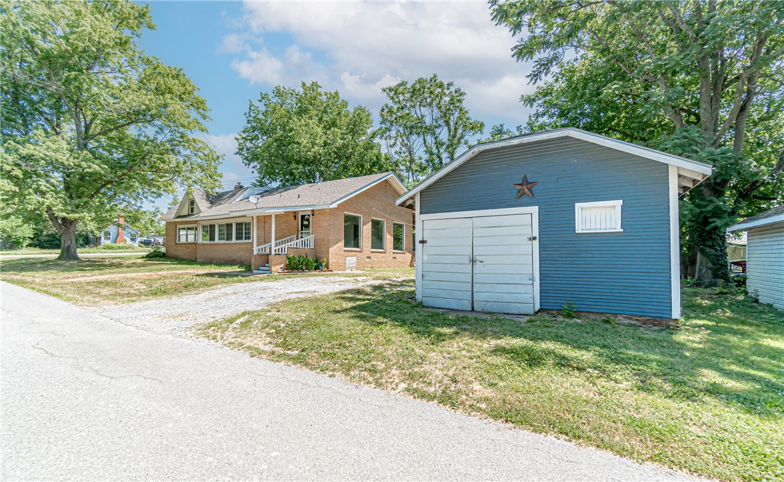 Charming home in the heart of Gravette! Youāll enjoy the spacious interior of the home and the abundance of natural light throughout. The recently remodeled kitchen features new paint, cabinets, 5 range gas stove, and subway tile backsplash. Opportunities for additional upgrades to the home allows you to customize it to make it your own. Enjoy summer evenings from your covered back porch and large yard that offers plenty of room for cookouts and hosting. The detached garage can double as a workshop or additional storage space. Located directly across the street from the Field Kindley Memorial Park and just seconds from local schools with quick access to endless activities year round, this home is in an ideal location. Welcome Home! *All offers will be reviewed by 5pm Monday July 11. However, the seller reserves the right to accept an offer at any time.*