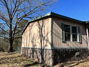 Come see this charming 3 bedroom 2 bath home with outbuildings and fenced backyard area as well as 3 sides of the property fenced. With 1.5 acres +/- and a little additional TLC this would make a great starter home for a small family or any investors dream. Metal roof just installed March 2021. Sold as is with any inspections for informational purposes only.