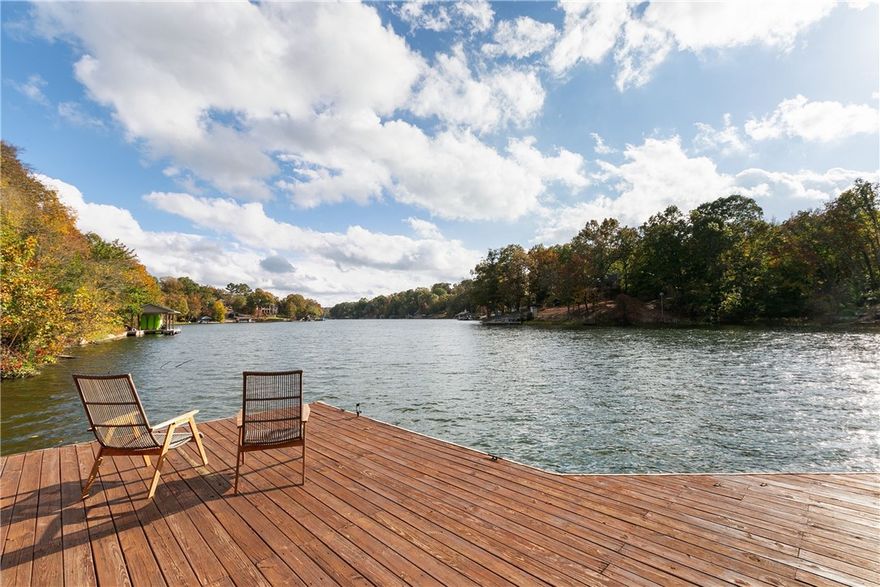 Newly remodeled home on the shores of Lake Loch Lomond!  All new Anderson Renewal windows, offers stunning, four-season views of the water throughout the home. 
The kitchen is a culinary haven, equipped with all-new custom cabinets, large island, double ovens, gas range, induction stove, and double-drawer dishwasher, ideal for cooking enthusiasts and those who love to entertain. The adjacent dining room is perfectly positioned for you to enjoy meals with a view. 
The primary suite is truly an oasis, with double doors leading to an expansive balcony. The lower level encompasses a second living area, second bedroom, and a versatile bonus room.
The spacious dock features a boat slip and two storage buildings. Additionally, this property boasts new HVAC and an EV charger.
Situated just minutes from the interstate, bike trails, restaurants and a multitude of amenities!