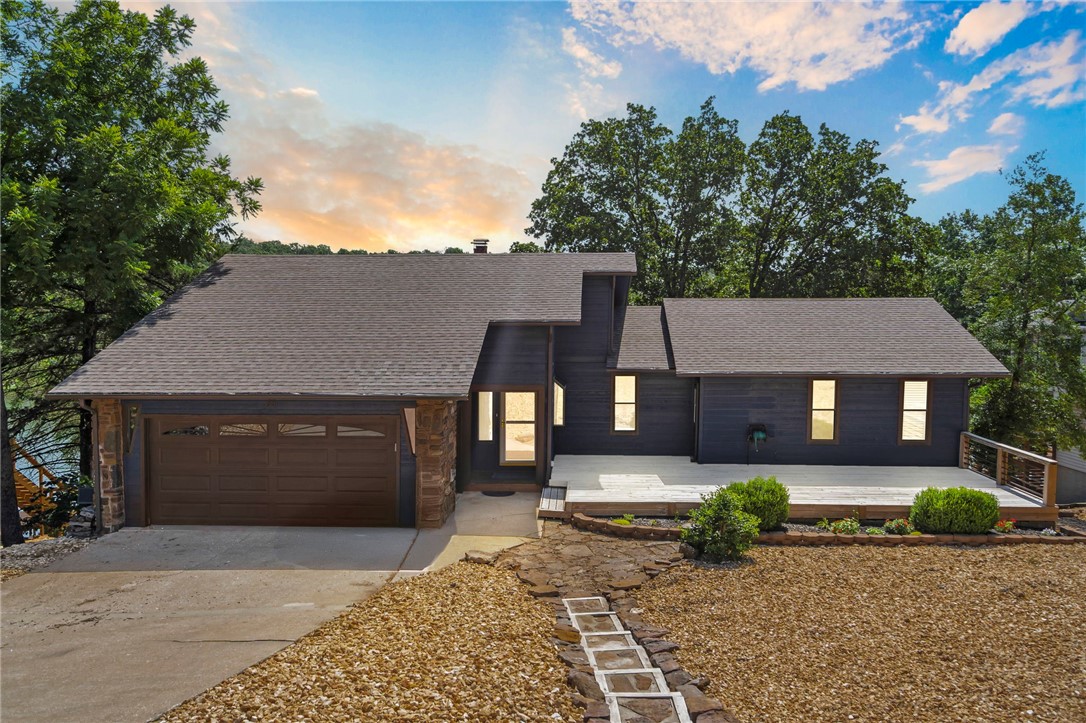 Welcome to your dream lakefront retreat on the coveted shores of Lake Windsor! This stunning, renovated and updated 3-bedroom, 2.5-bath home is designed for both relaxation and entertaining, with sweeping lake views. Enjoy direct access to the water with your own boat dock and sauna room, perfect for unwinding after a day on the lake. Step inside to discover bright, open living spaces filled with natural light from expansive windows and doors. Two fireplacesāone on each levelācreate a warm, inviting atmosphere for cozy evenings. For those who love to cook and entertain, this property offers two full kitchens! This feature opens up exciting possibilities, from a mother-in-law suite to an Airbnb opportunity, making this home as versatile as it is enticing. This lakefront home is situated just minutes from the interstate, bike trails(including the newly announced downhill bike park), downtown Bentonville, and less than 20 minutes to the new Walmart Home Office. Don't miss the chance to own this lakefront oasis.