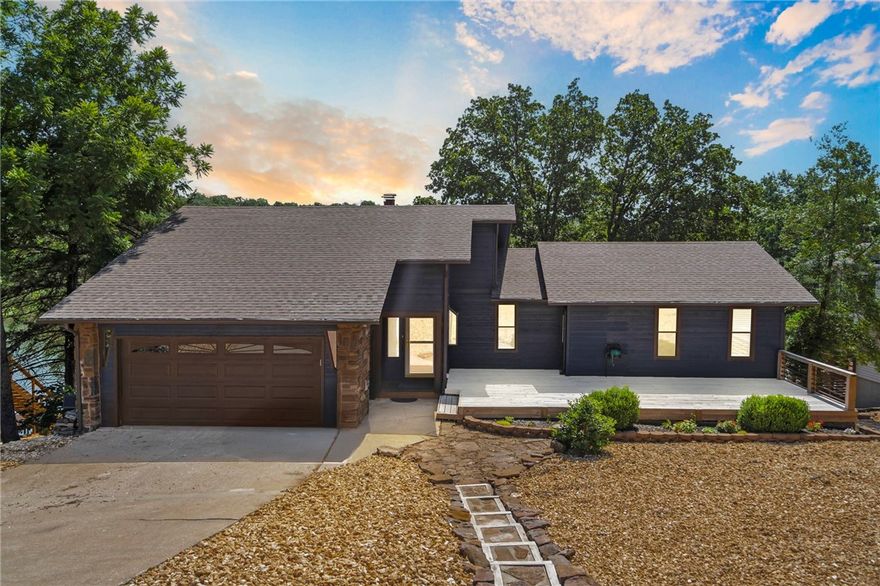 Welcome to your dream lakefront retreat on the coveted shores of Lake Windsor! This stunning, renovated and updated 3-bedroom, 2.5-bath home is designed for both relaxation and entertaining, with sweeping lake views. Enjoy direct access to the water with your own boat dock and sauna room, perfect for unwinding after a day on the lake. Step inside to discover bright, open living spaces filled with natural light from expansive windows and doors. Two fireplaces—one on each level—create a warm, inviting atmosphere for cozy evenings. For those who love to cook and entertain, this property offers two full kitchens! This feature opens up exciting possibilities, from a mother-in-law suite to an Airbnb opportunity, making this home as versatile as it is enticing. This lakefront home is situated just minutes from the interstate, bike trails(including the newly announced downhill bike park), downtown Bentonville, and less than 20 minutes to the new Walmart Home Office. Don't miss the chance to own this lakefront oasis.