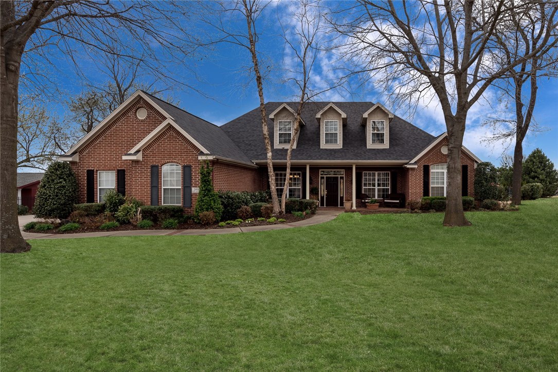 This gorgeous 5 bed 5 bath estate home sits on a little over an acre in a great location with close access to I-49. Home has a neighborhood feel, but also private enough! Living area with real hardwood floors,fireplace, formal dining area and office with closet and french doors. Spacious kitchen with granite counters, stainless steel appliances island and bar top seating and built-in desk area. Large master bedroom with private deck for a hot tub, gorgeous master bath with double vanity sinks and custom cabinets, garden tub and walk in shower. Upstairs you will find large bonus room, 2 bedrooms and bath. Guest house studio with kitchenette, & full bathroom. Enjoy the luxuries of your fenced, in-ground pool as well your covered patio and Basketball court-all great for entertaining your guest! Home has easy access to Lost Springs golfing, and ponds. This home is a MUST-SEE! Call today to schedule your showing!